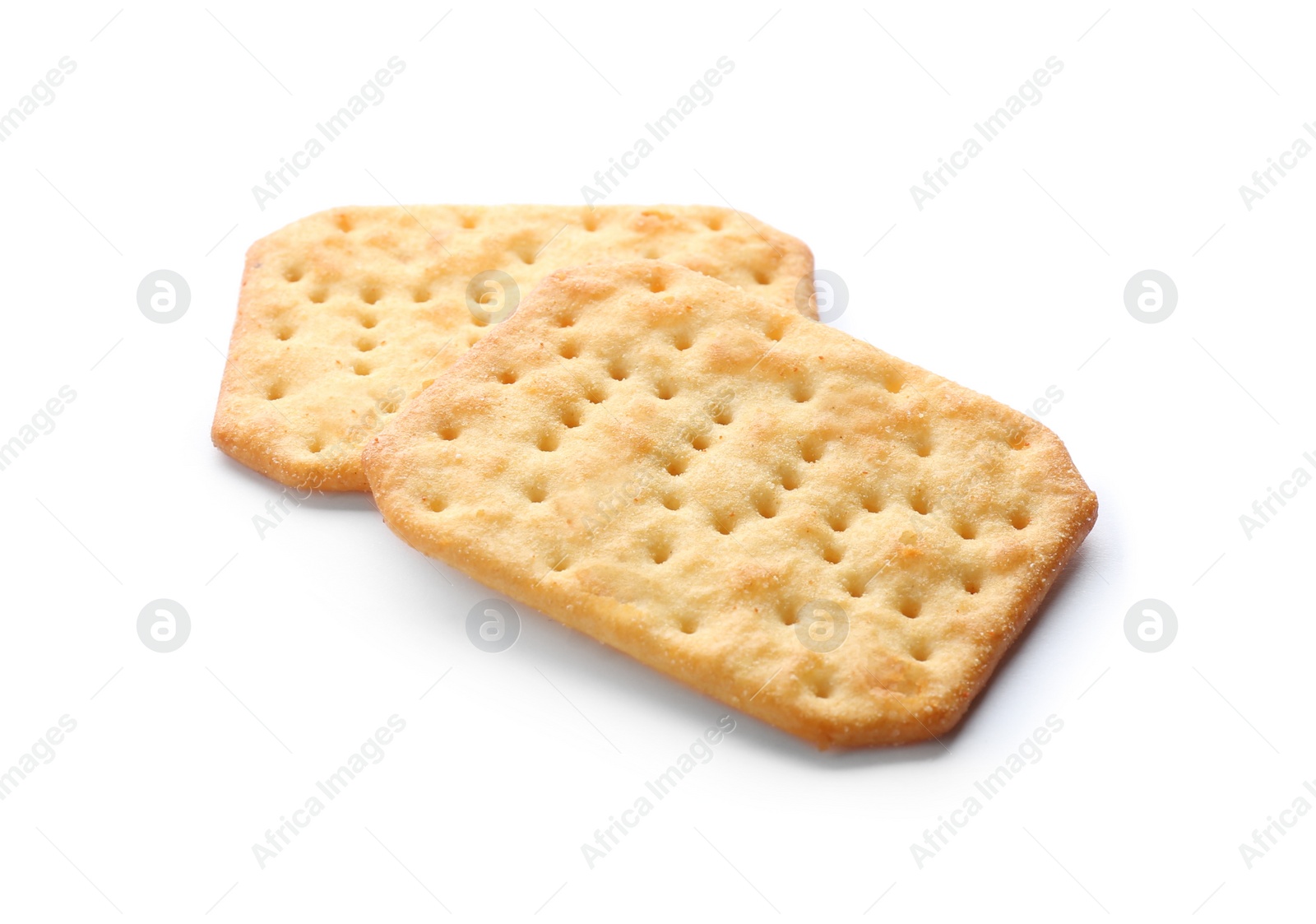 Photo of Crispy crackers isolated on white. Delicious snack