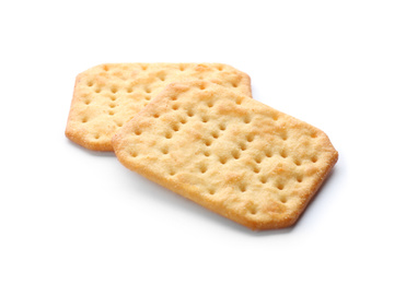 Photo of Crispy crackers isolated on white. Delicious snack