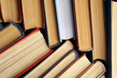 Photo of Many different hardcover books as background, top view