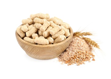 Photo of Granulated wheat bran in bowl and spikelets on white background