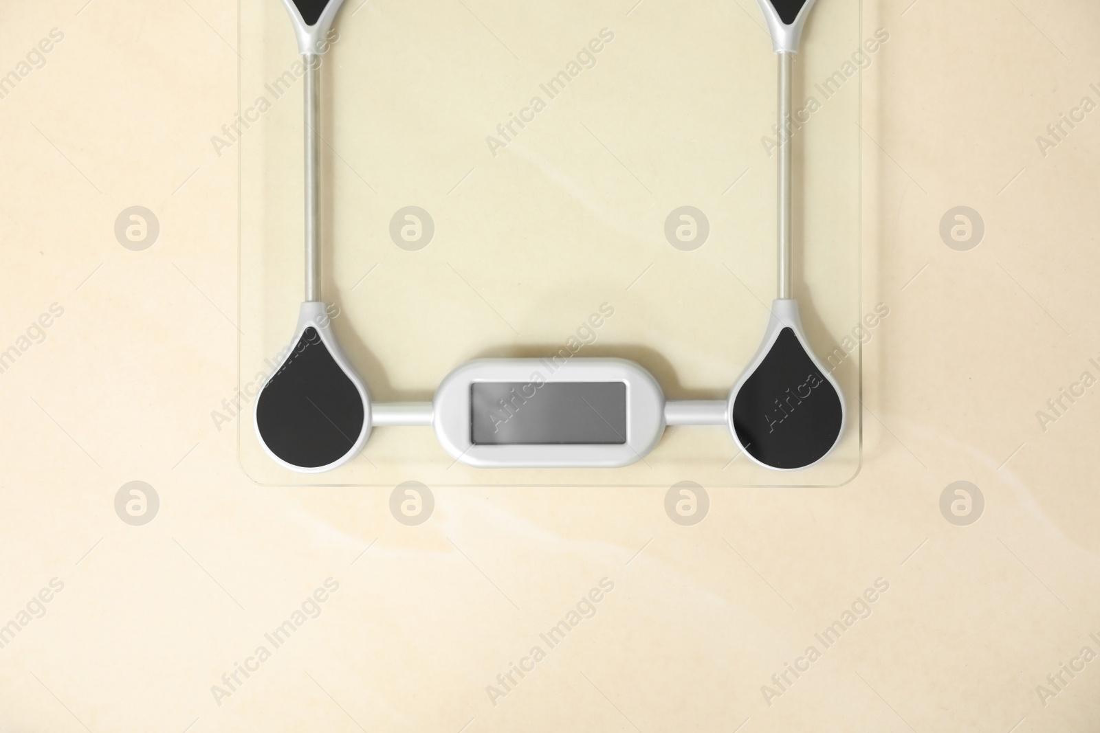 Photo of Scales on floor, top view. Overweight problem