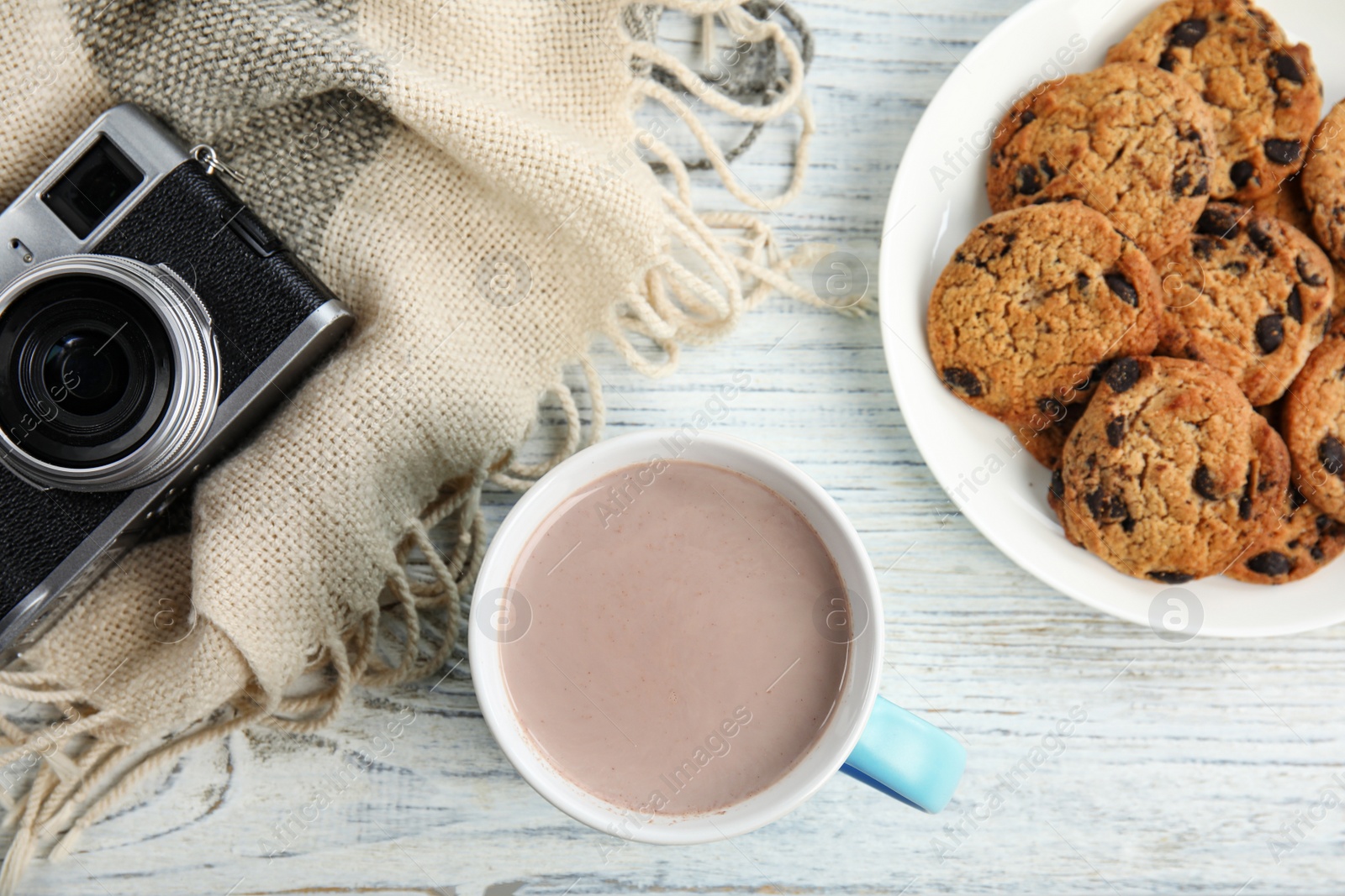 Photo of Flat lay composition with cup of hot cocoa on white wooden table. Winter drink