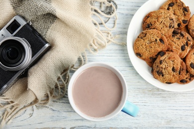 Photo of Flat lay composition with cup of hot cocoa on white wooden table. Winter drink