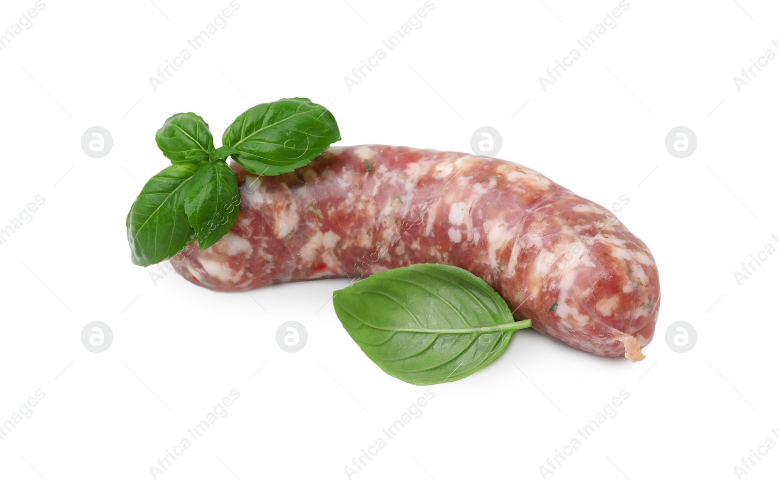 Photo of Raw homemade sausage and basil leaves isolated on white