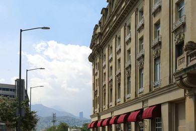 Photo of Beautiful view of city with modern building in mountains