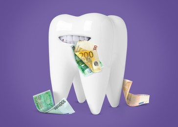 Image of Funny model of tooth with euro banknotes on violet background. Concept of expensive dental procedures