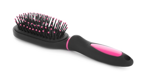 Photo of New modern hair brush isolated on white