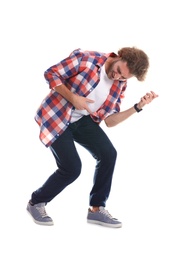 Young man playing air guitar on white background