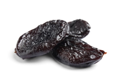 Tasty prunes on white background. Dried fruit as healthy snack