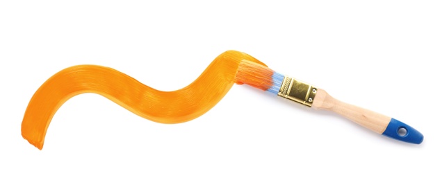 Photo of Brush with orange paint on white background, top view