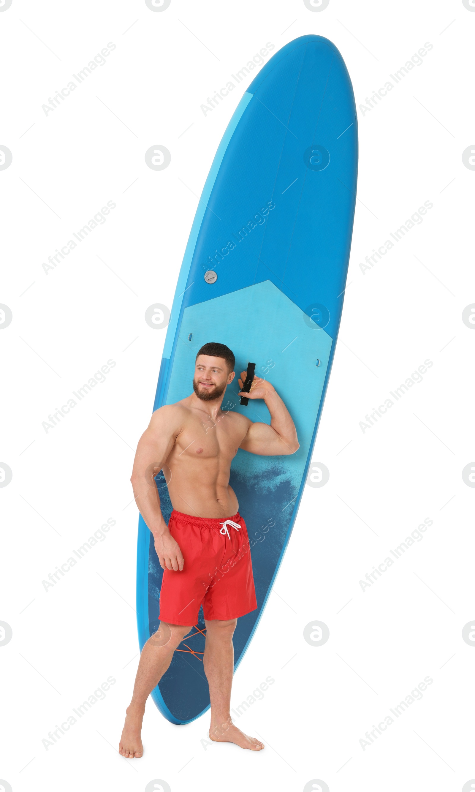 Photo of Handsome man with blue SUP board on white background