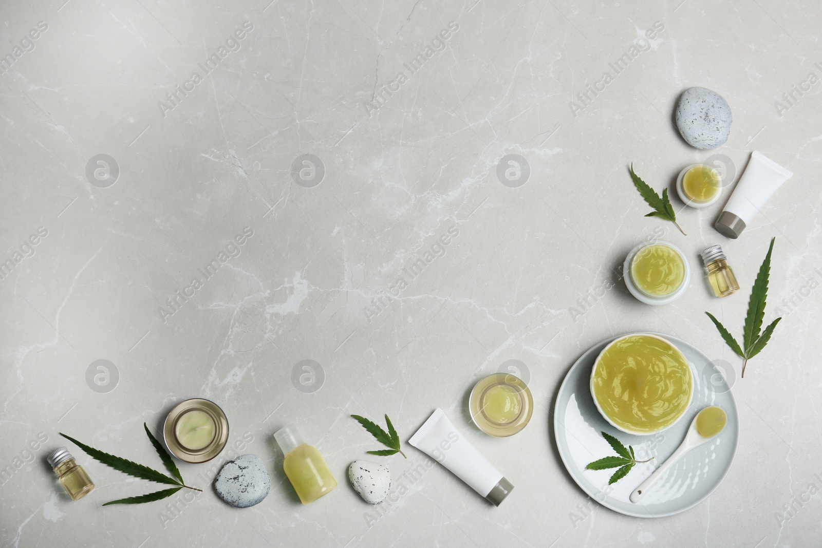 Photo of Flat lay composition with hemp lotion on grey background