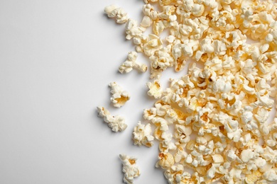 Photo of Delicious fresh popcorn on white background, top view