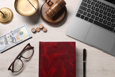 Photo of Tax law. Flat lay composition with book and gavel on wooden table