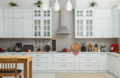 Photo of Beautiful kitchen interior with stylish modern furniture