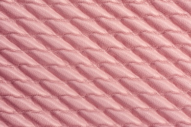 Photo of Texture of rose gold leather as background