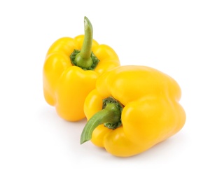 Photo of Ripe yellow bell peppers isolated on white