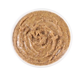 Photo of Delicious nut butter in bowl isolated on white, top view