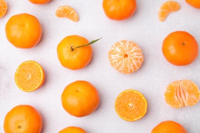 Photo of Fresh juicy tangerines on light grey table, flat lay