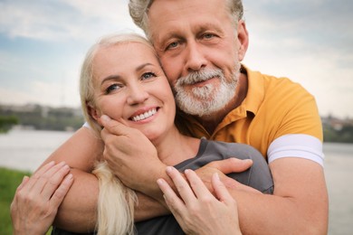 Photo of Happy mature couple spending time together in park