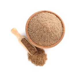 Photo of Wooden bowl and scoop with brown salt on white background, top view