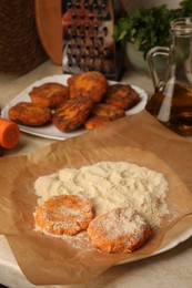Photo of Raw vegan cutlets with flour on plate