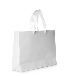 Photo of Paper shopping bag isolated on white. Mock up for design