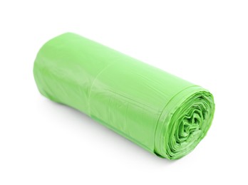 Photo of Roll of light green garbage bags isolated on white