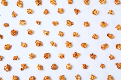 Photo of Flat lay composition with caramel popcorn on white background