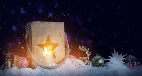 Image of Composition with wooden Christmas lantern on snow, space for text. Magical atmosphere 