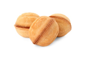 Photo of Delicious nut shaped cookies with condensed milk on white background