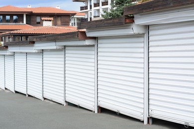 Photo of Stalls closed with roller shutters in city