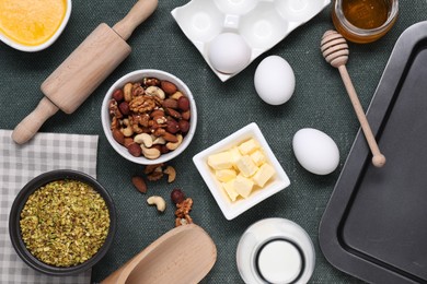 Photo of Different ingredients for making delicious baklava on table, flat lay