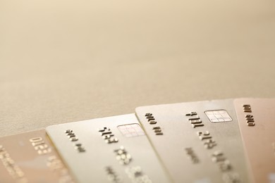 Photo of Different credit cards on table, closeup view. Space for text