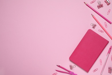 Different stationery on pink background, flat lay. Space for text