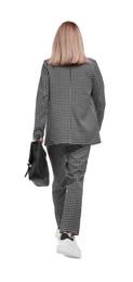 Photo of Businesswoman in suit with briefcase walking on white background, back view