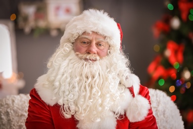 Photo of Authentic Santa Claus with bushy white beard indoors