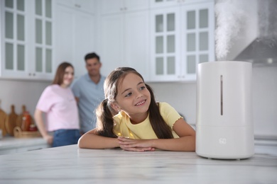 Photo of Family in kitchen with modern air humidifier