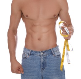 Photo of Shirtless man with slim body and measuring tape isolated on white, closeup