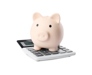 Calculator and piggy bank isolated on white