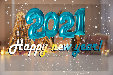 Image of Festive balloons and text HAPPY NEW YEAR on blurred background