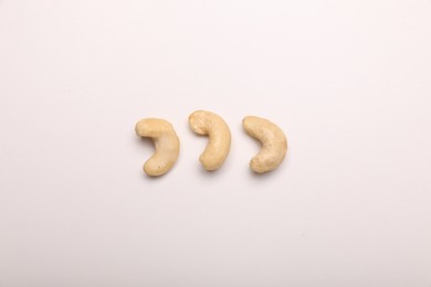 Photo of Tasty cashew nuts on white background, top view
