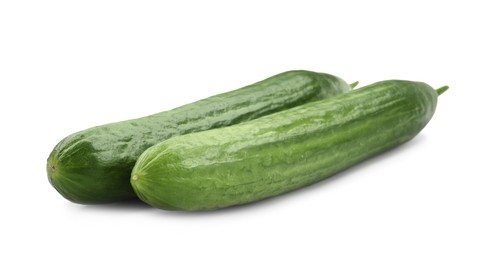Photo of Two long fresh cucumbers isolated on white