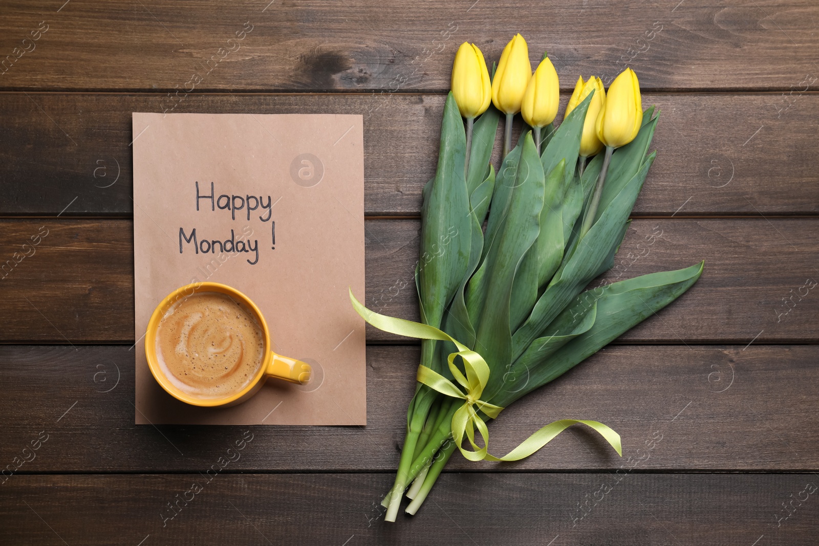 Photo of Happy Monday message, aromatic coffee and tulips on wooden table, flat lay