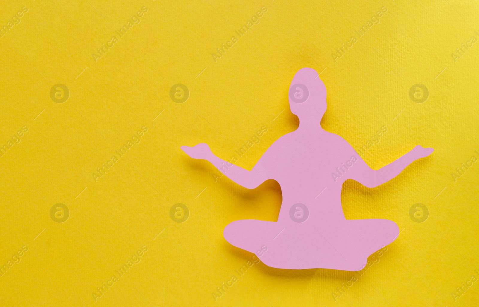 Photo of Woman`s health. Paper female figure on yellow background, top view with space for text