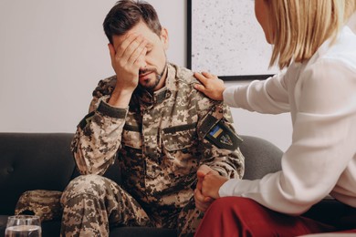 Photo of Psychologist supporting military officer in office, closeup