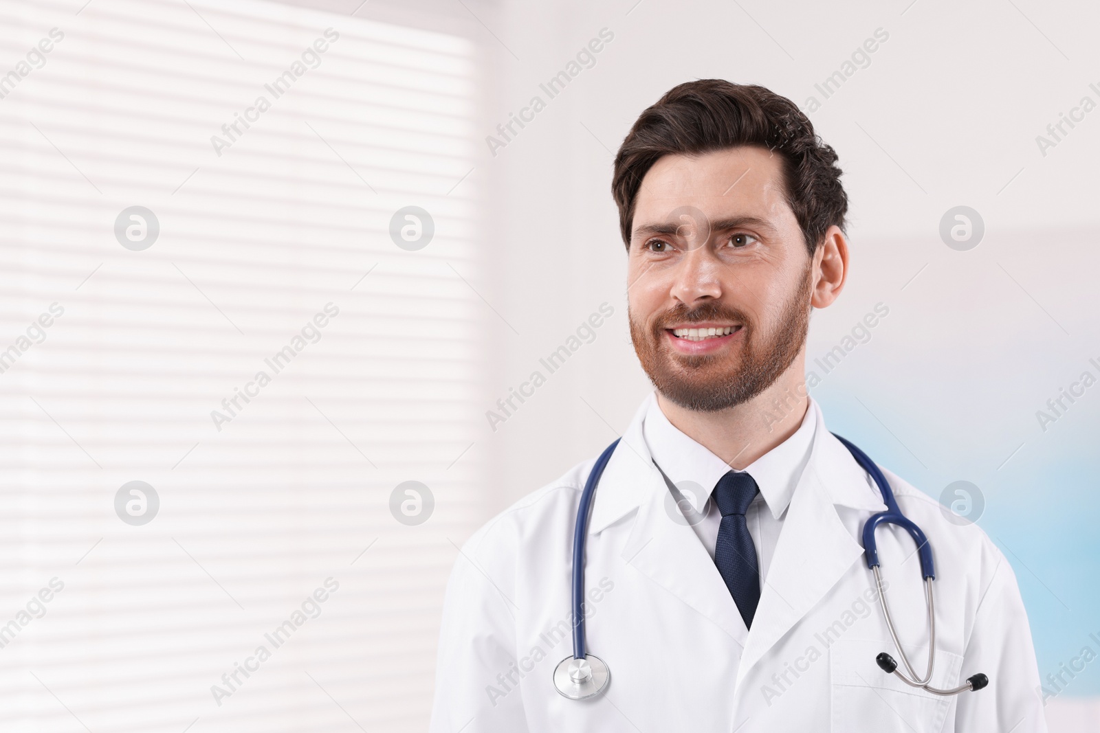 Photo of Medical consultant with stethoscope in clinic, space for text