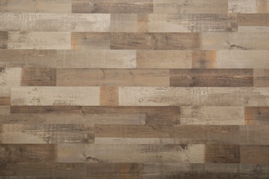 Photo of Wooden laminate as background, top view. Floor covering