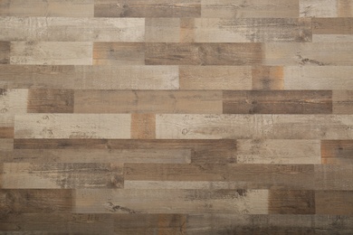 Wooden laminate as background, top view. Floor covering