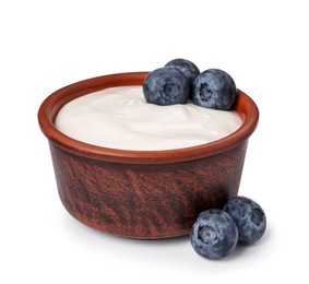 Bowl of delicious yogurt with blueberries on white background